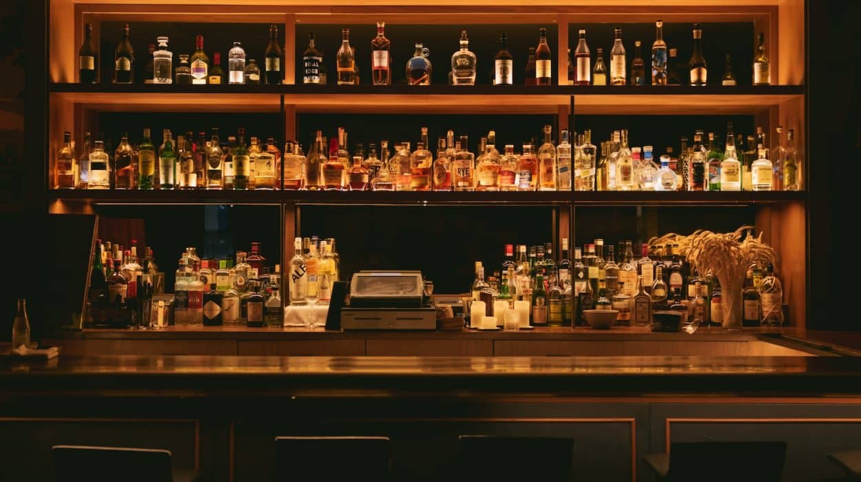 brown wooden shelf with bottles